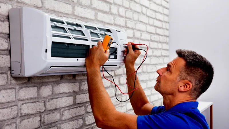 Professional technician performing AC repair on residential unit